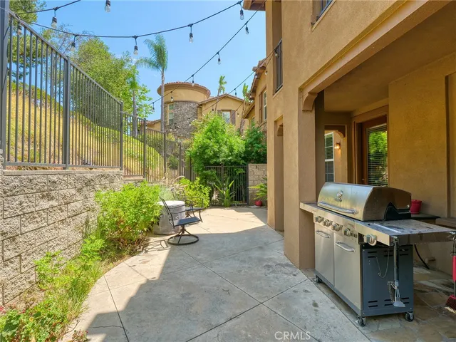 a view of a backyard with sitting area