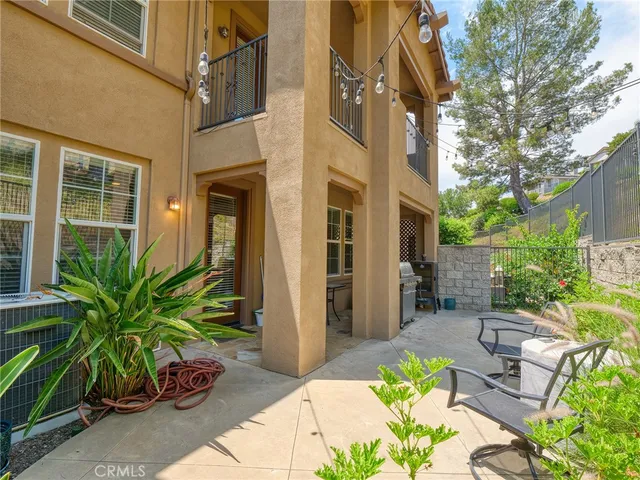 a view of a lobby with chair and potted plants