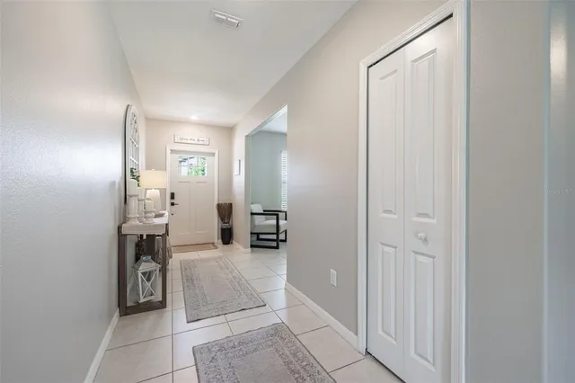 a view of a hallway with dining area