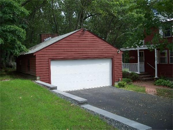 43 County Road Andover, MA 01810 - Photo 2 of 17 a front view of a house with a yard and garage