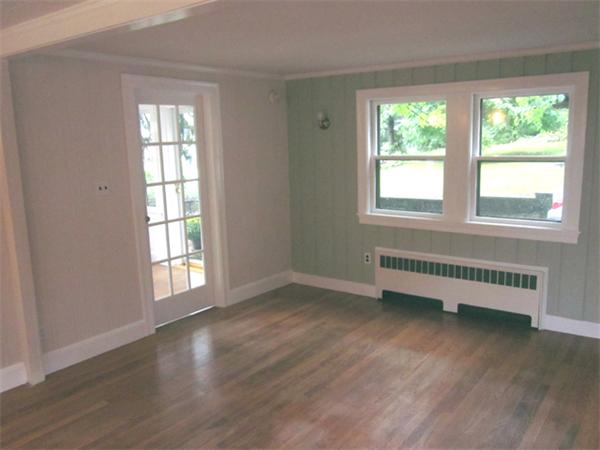43 County Road Andover, MA 01810 - Photo 5 of 17 an empty room with wooden floor and windows