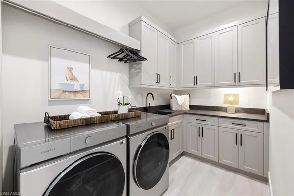 a kitchen with cabinets and washer