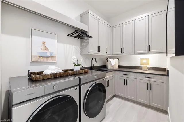 a kitchen with cabinets and washer