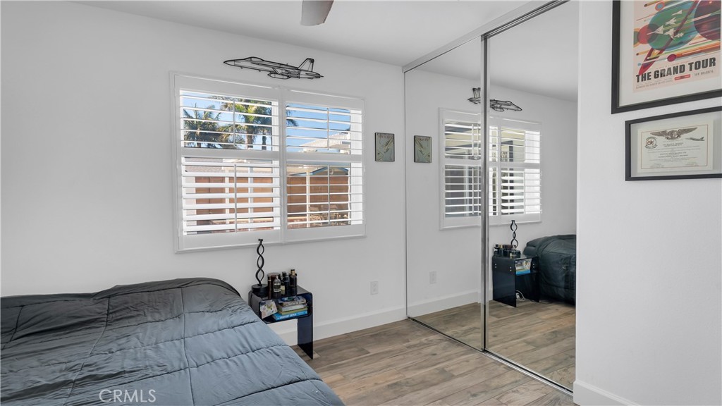 16281 Golden Gate Lane Huntington Beach, CA 92649 - Photo 17 of 22 a bedroom with a bed and a window