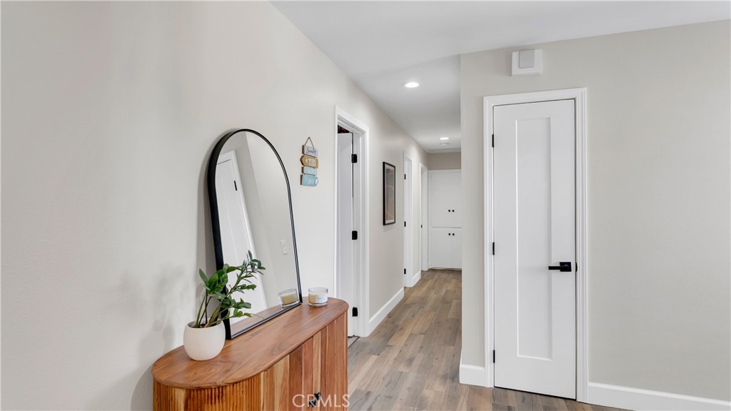 16281 Golden Gate Lane Huntington Beach, CA 92649 - Photo 10 of 22 wooden floor with windows and stairs