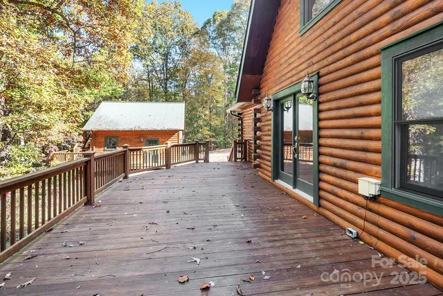 a view of a patio with a table and chairs and wooden floor