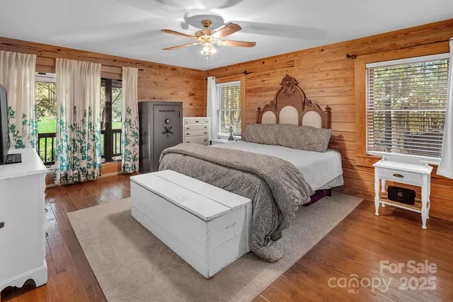 a spacious bedroom with a bed and a couch