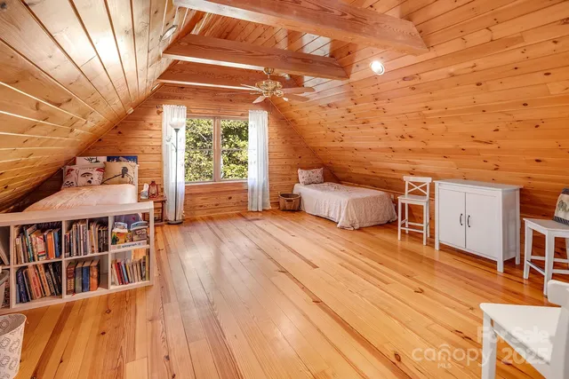 a view of a living room and wooden floor