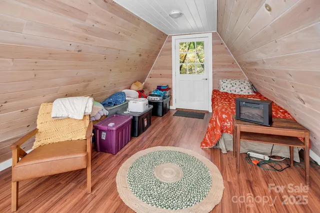 a view of a chairs and table on the wooden floor