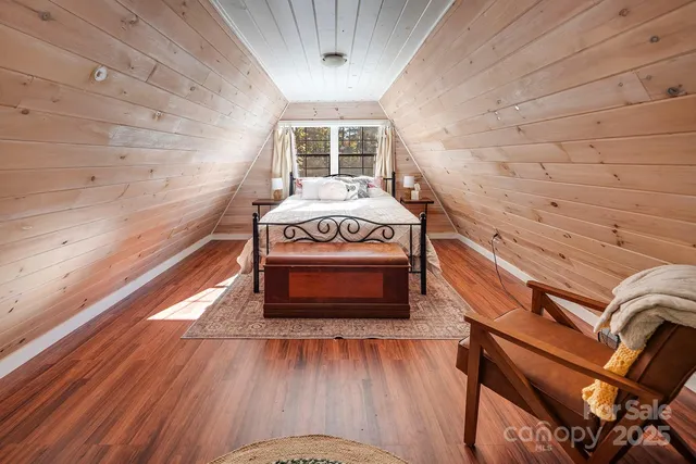 a view of a patio with table and chairs and wooden fence