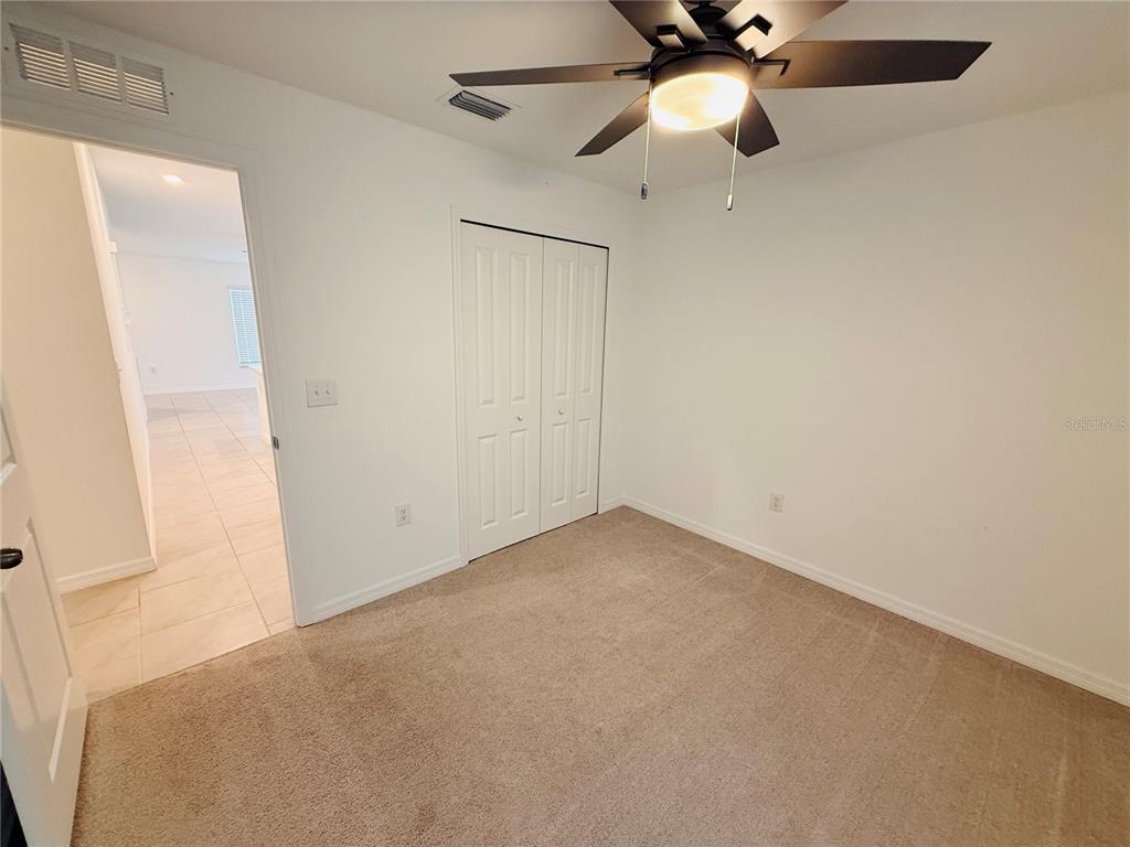 4034 San Clemente Court North Fort Myers, FL 33917 - Photo 13 of 22 an empty room with a window and a fan