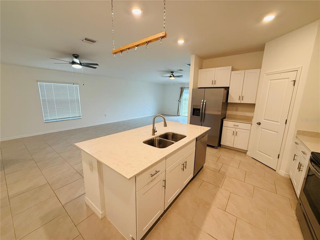 4034 San Clemente Court North Fort Myers, FL 33917 - Photo 14 of 22 a kitchen that has a sink and a stove in it