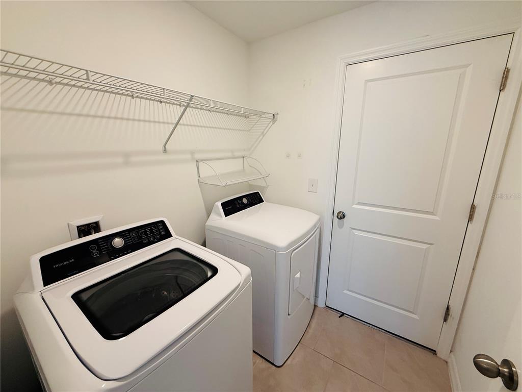 4034 San Clemente Court North Fort Myers, FL 33917 - Photo 20 of 22 a utility room with dryer and washer