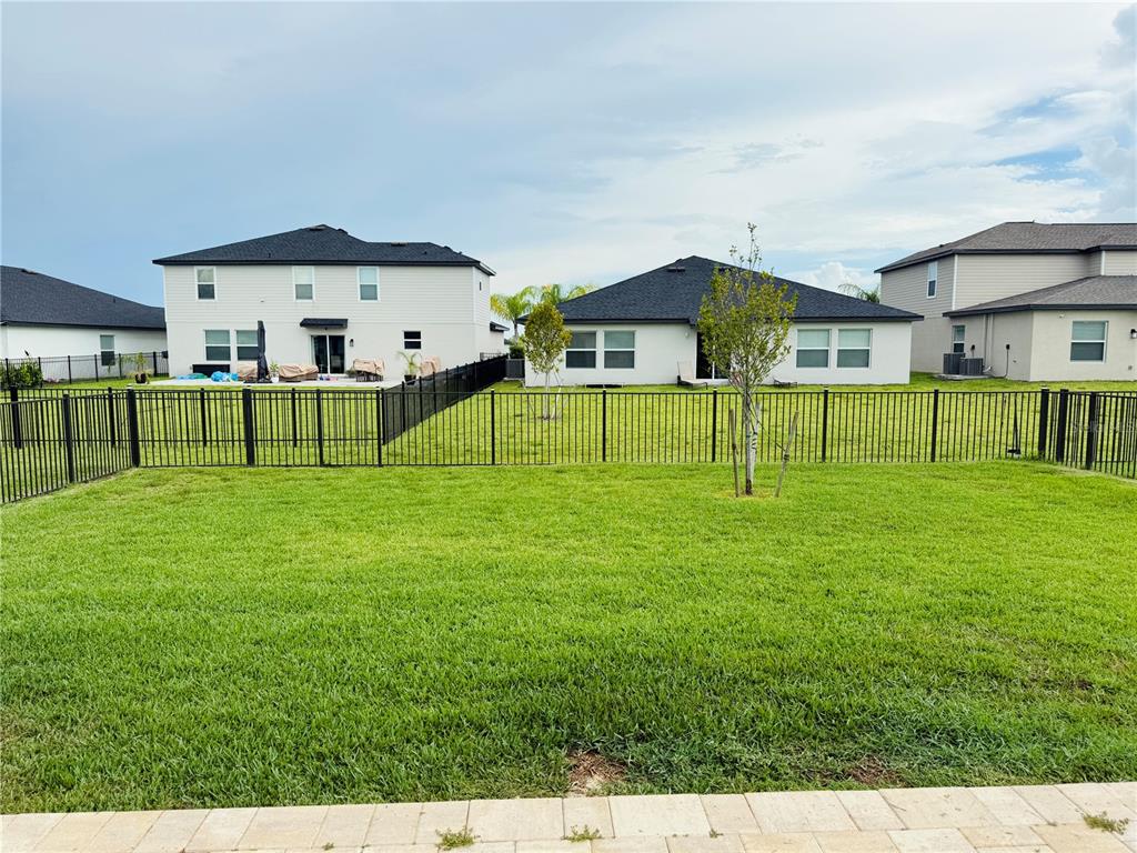 4034 San Clemente Court North Fort Myers, FL 33917 - Photo 8 of 22 a view of house with a big yard and large trees