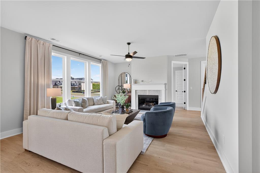 2600 Parkside Way Gainesville, GA 30507 - Photo 13 of 41 a living room with furniture a fireplace and a large window
