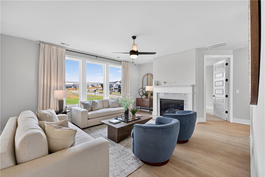 2600 Parkside Way Gainesville, GA 30507 - Photo 17 of 41 a living room with furniture a fireplace and a large window