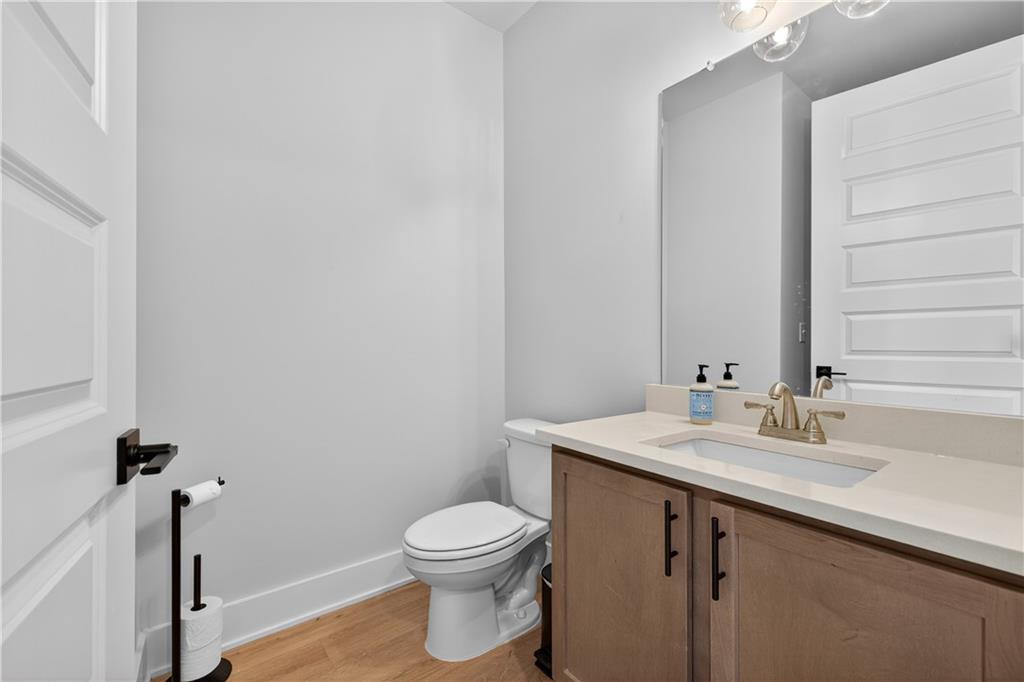 2600 Parkside Way Gainesville, GA 30507 - Photo 21 of 41 a bathroom with a sink a toilet and mirror