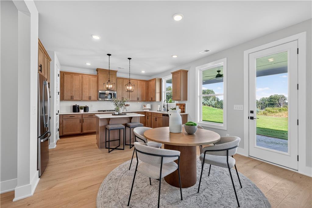 2600 Parkside Way Gainesville, GA 30507 - Photo 5 of 41 a kitchen with a table and chairs in it