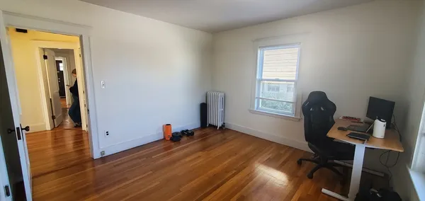 a workspace with furniture and a window