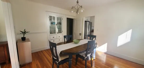 a view of a dining room with furniture and window