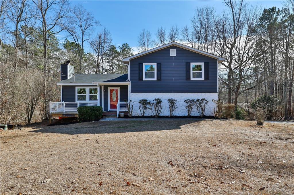 6801 Birch Road Winston, GA 30187 - Photo 1 of 1 a front view of a house with a yard