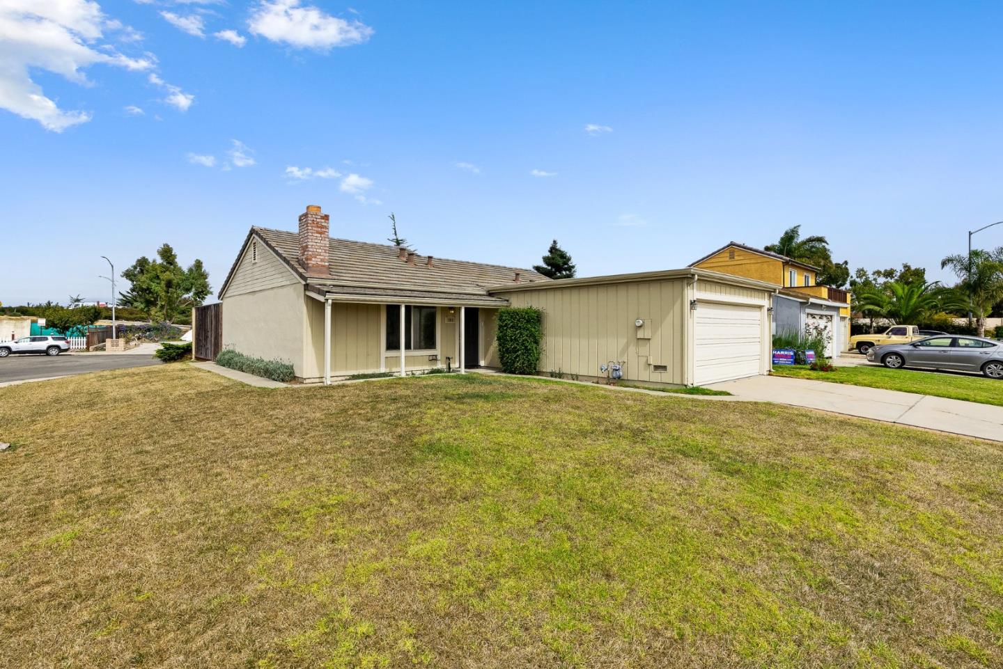 703 Sherman Circle Salinas, CA 93907 - Photo 12 of 25 a view of a white house with a big yard and large trees