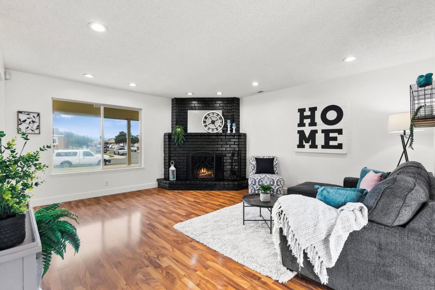 703 Sherman Circle Salinas, CA 93907 - Photo 3 of 25 a living room with furniture and a fireplace