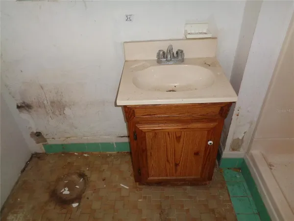 a bathroom with a sink and a toilet