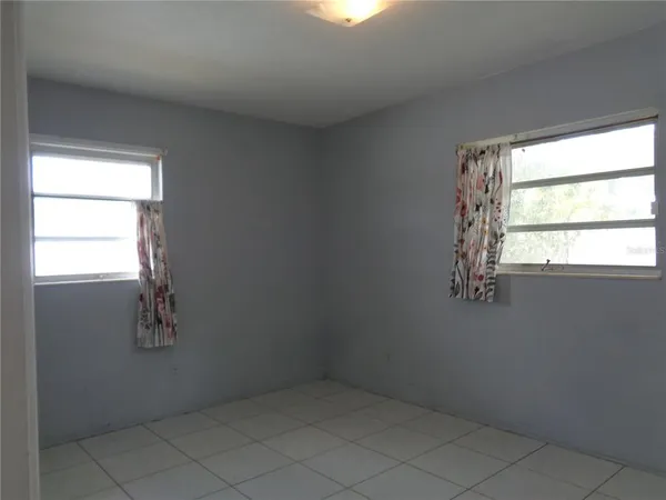 a bath tub sitting next to a shower