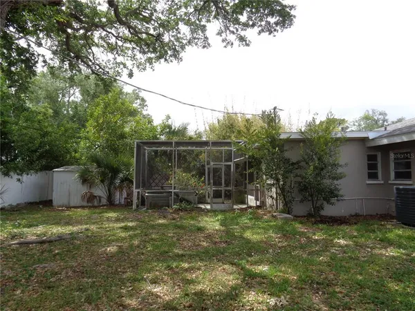 a backyard of a house with lots of green space