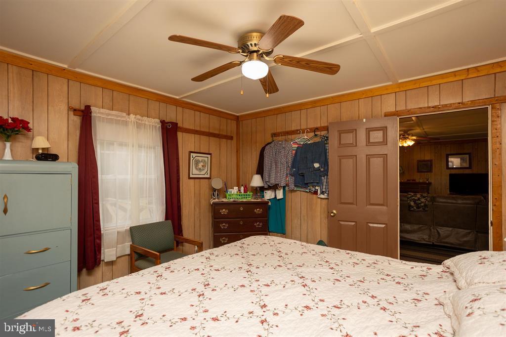 49 Mount Top Road Baker, WV 26801 - Photo 16 of 34 a bedroom with a bed and a dresser