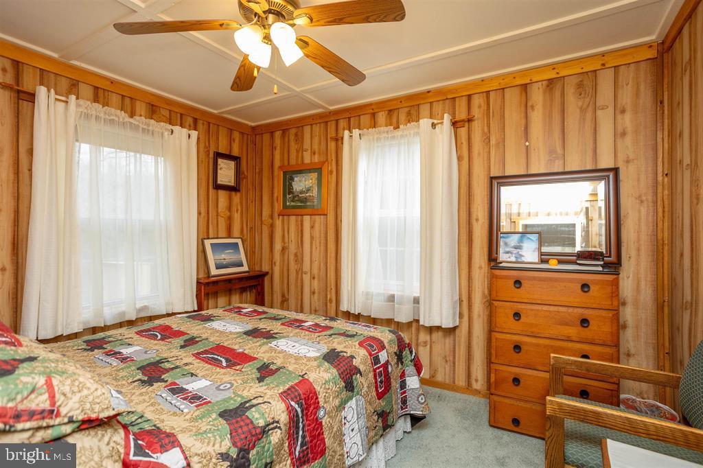 49 Mount Top Road Baker, WV 26801 - Photo 18 of 34 a bedroom with a bed and a mirror on the dresser