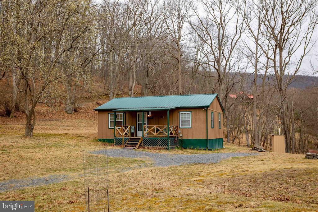 49 Mount Top Road Baker, WV 26801 - Photo 27 of 34 a front view of a house with a yard