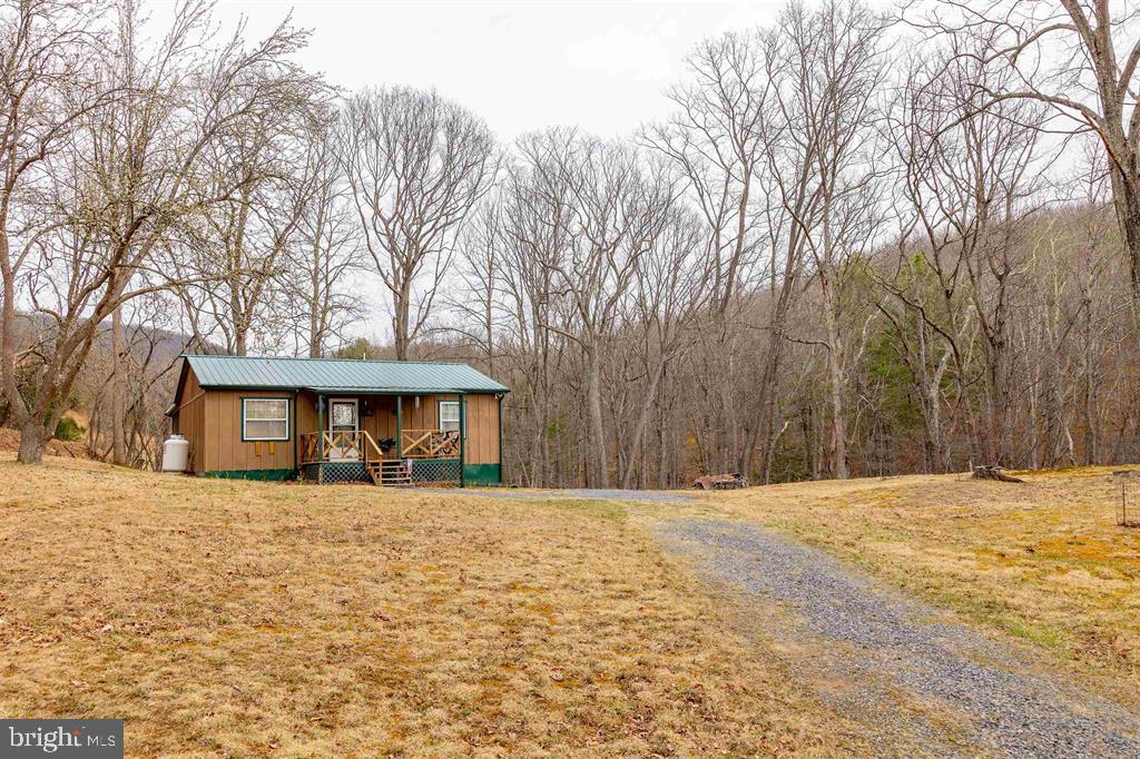 49 Mount Top Road Baker, WV 26801 - Photo 28 of 34 a house with trees in front of it