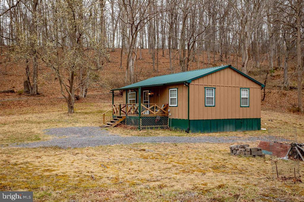49 Mount Top Road Baker, WV 26801 - Photo 3 of 34 a front view of a house with garden