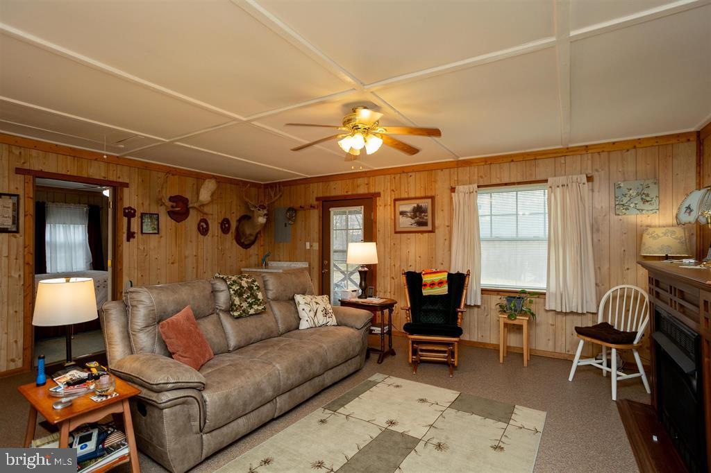 49 Mount Top Road Baker, WV 26801 - Photo 8 of 34 a living room with furniture and a chandelier
