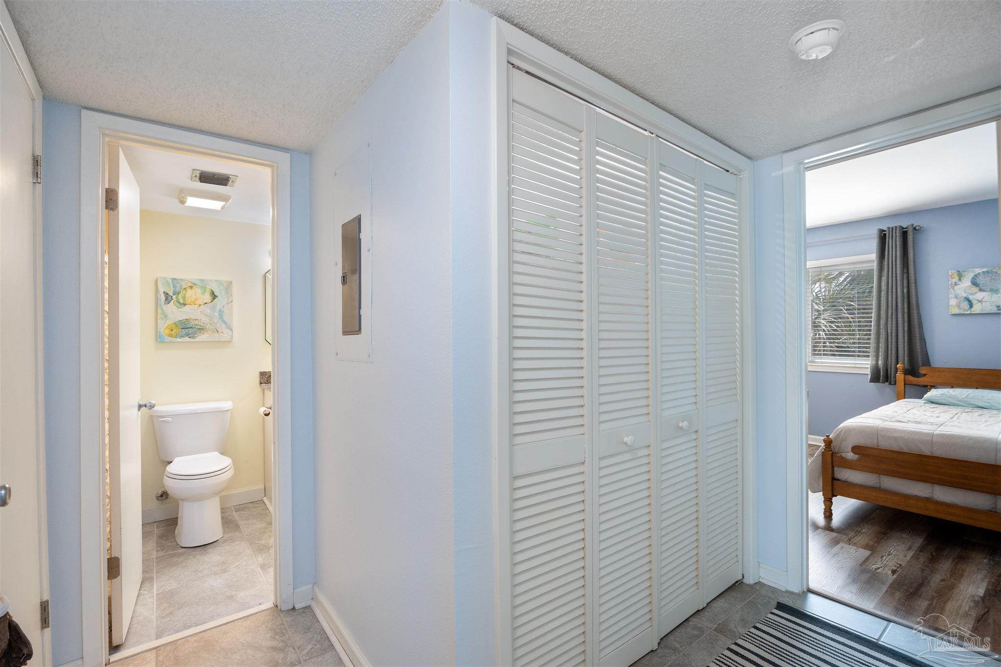 14100 River Road, Unit 228B Pensacola, FL 32507 - Photo 19 of 41 a bathroom with a granite countertop toilet and a sink