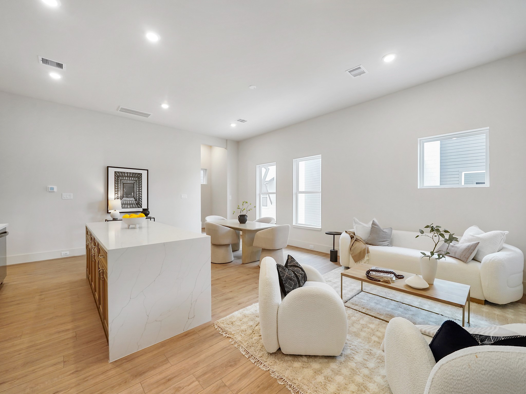 861 Rachel Street, Unit E Houston, TX 77091 - Photo 5 of 29 Experience the perfect blend of style and functionality with this open-concept space, offering plenty of counter space and bathed in abundant natural light.