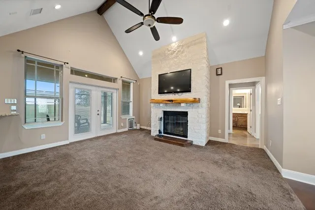 a view of a room with window wooden floor and front door