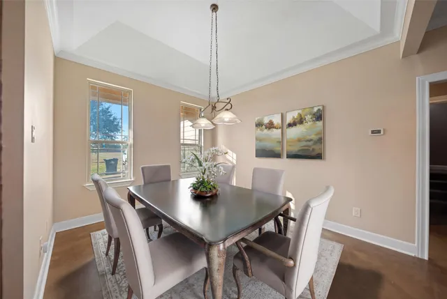 a kitchen with stainless steel appliances granite countertop wooden cabinets a sink and a refrigerator