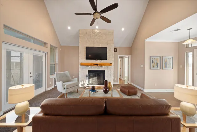 an empty room with sliding glass door and mountain view