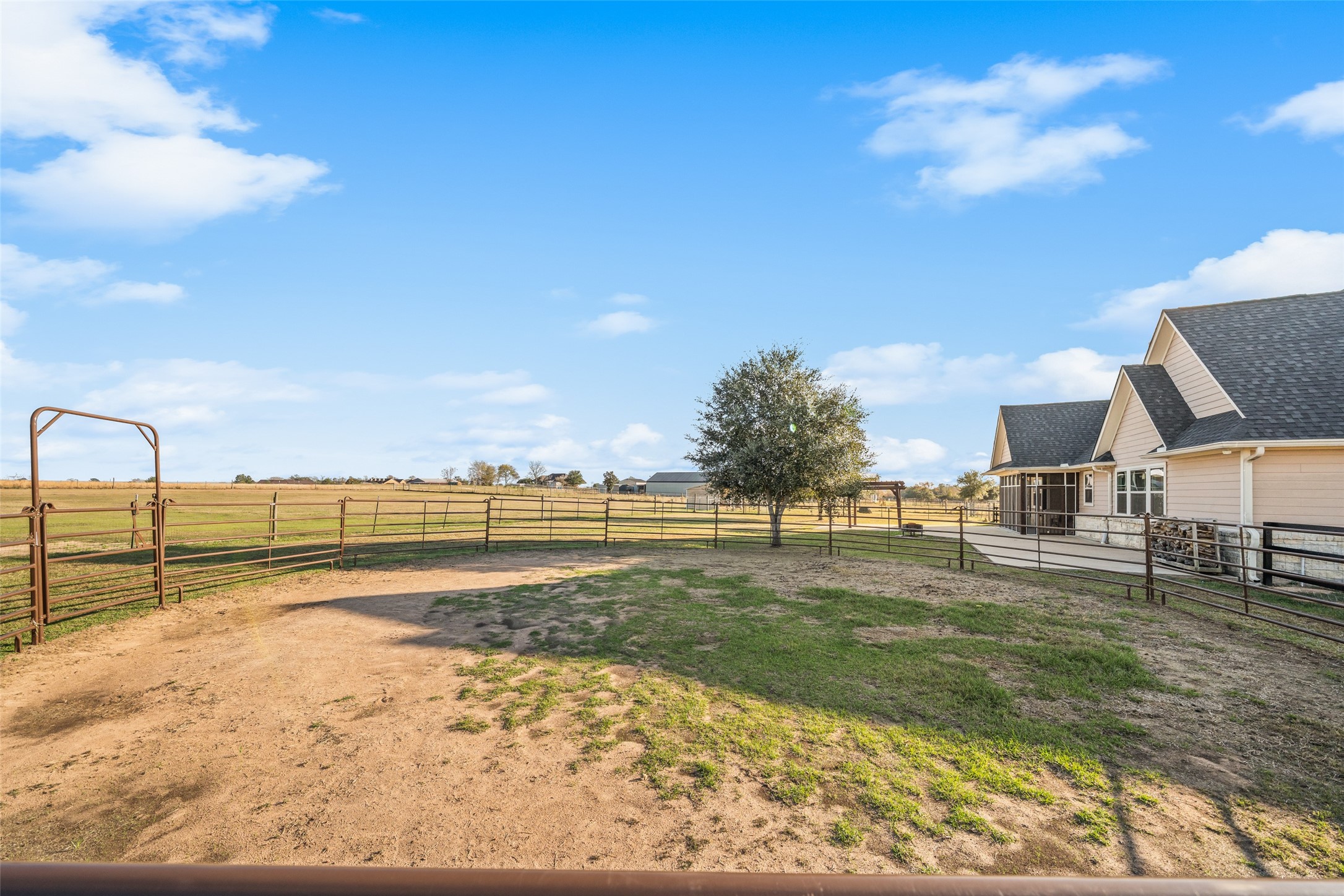 26752 Nelson Road Hempstead, TX 77445 - Photo 27 of 45 Fenced round pen provides a functional space for training or handling horses, conveniently located near the home.