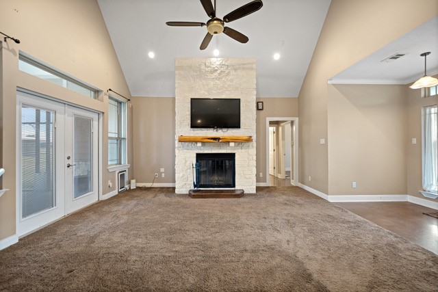 26752 Nelson Road Hempstead, TX 77445 - Photo 7 of 45 Vaulted ceilings and a floor-to-ceiling stone fireplace anchor the main living area, offering generous space for everyday living and gatherings.
