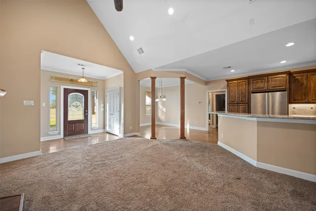 a view of a livingroom with a ceiling fan window and fireplace
