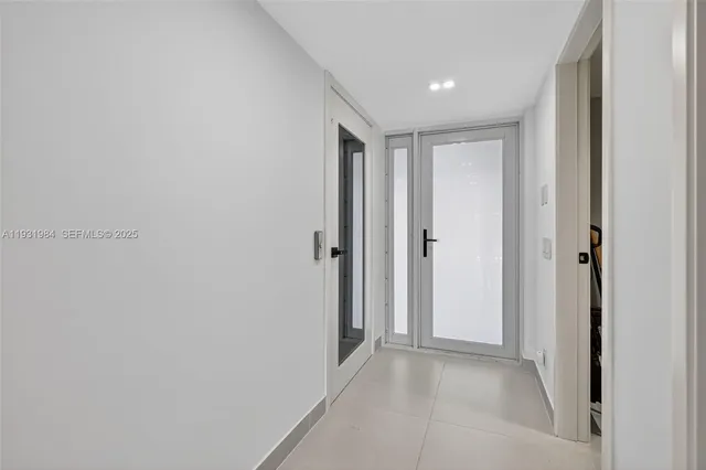 a kitchen with stainless steel appliances a sink and a refrigerator