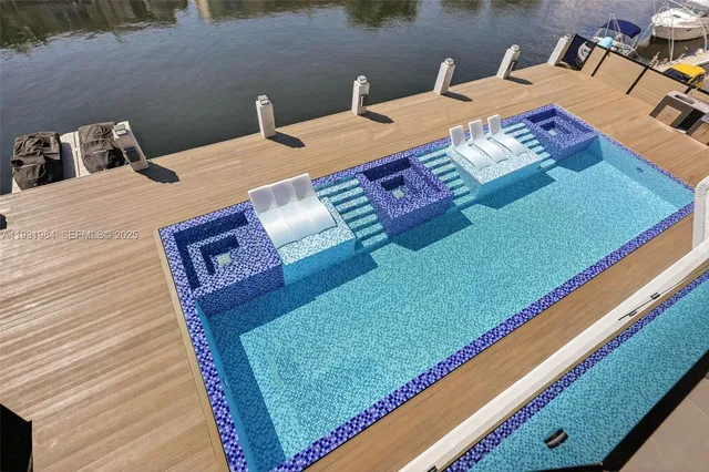 a view of a lake with a table and chairs