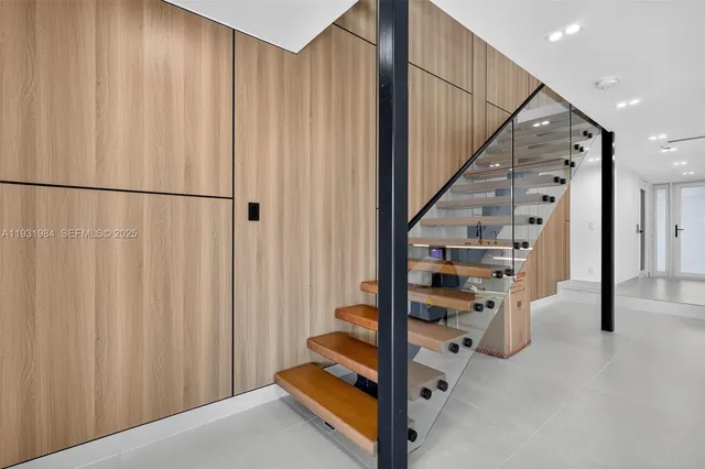 a living room with furniture and white walls