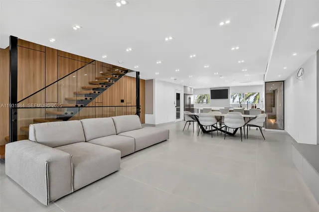 a view of a lake with couches and city view