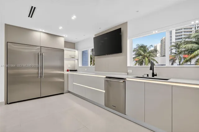 a bathroom with a glass shower door