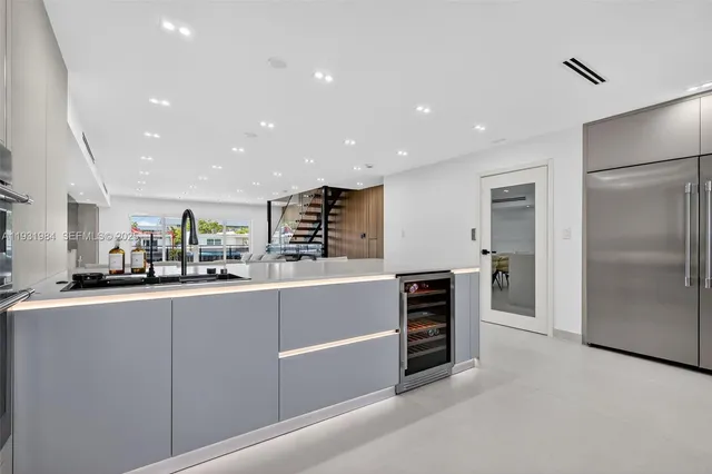 a spacious bedroom with a bed and large window